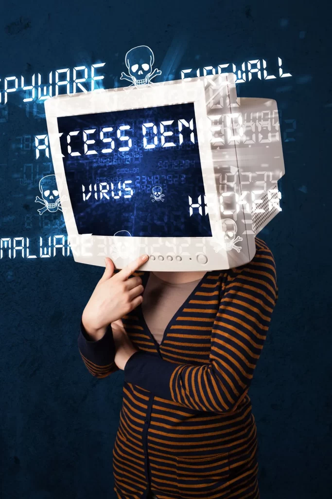 Person with a computer monitor for a head displaying "ACCESS DENIED" and "VIRUS" text, surrounded by digital symbols representing malware and hacking, highlighting the theme of phone virus repair services.